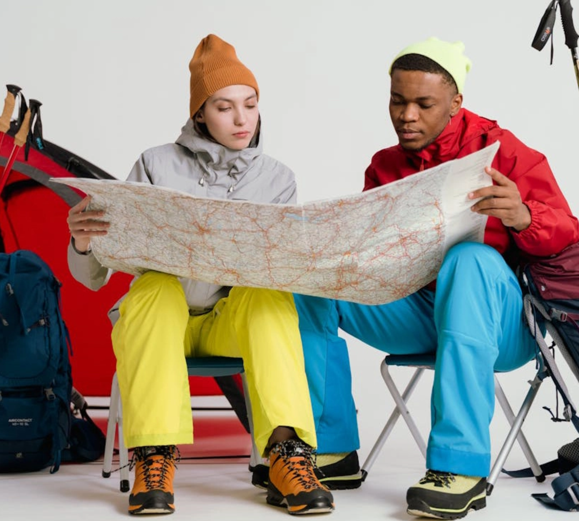 Two hikers reading map