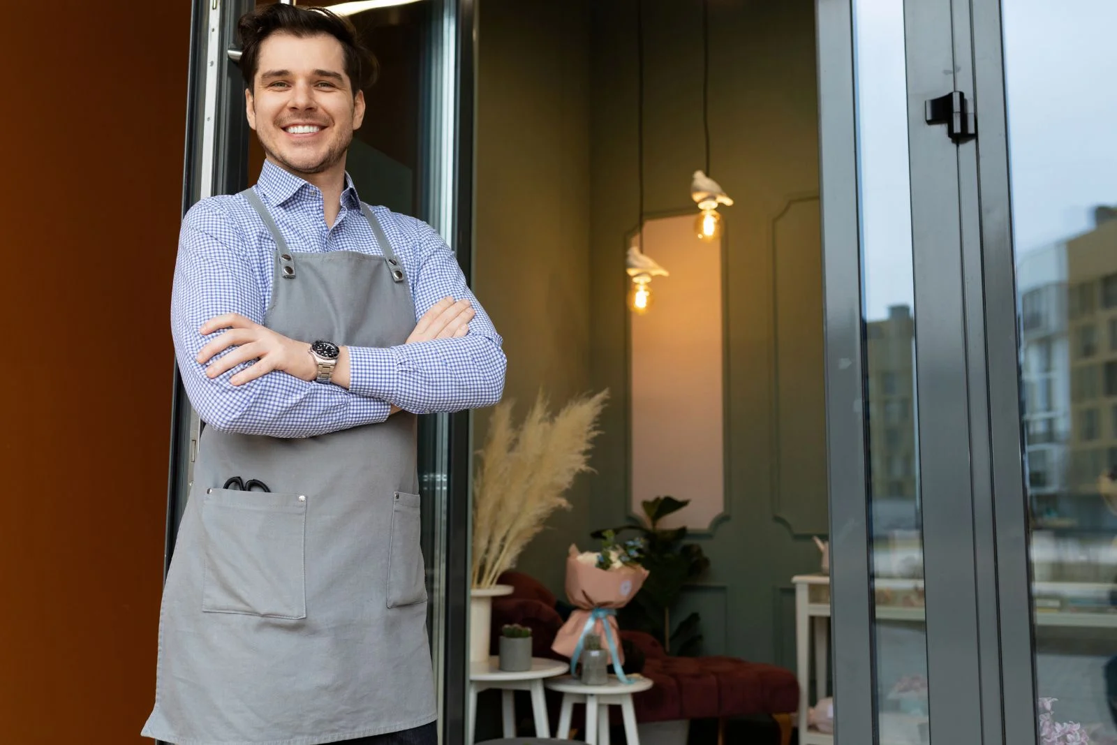 Retail entrepreneur standing door
