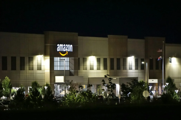 Amazon office building at night amid AI job cuts