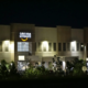 Amazon office building at night amid AI job cuts